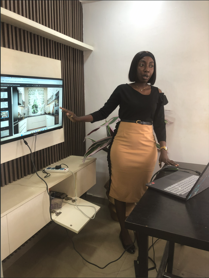 A student presenting her final project on screen at the Abuja campus